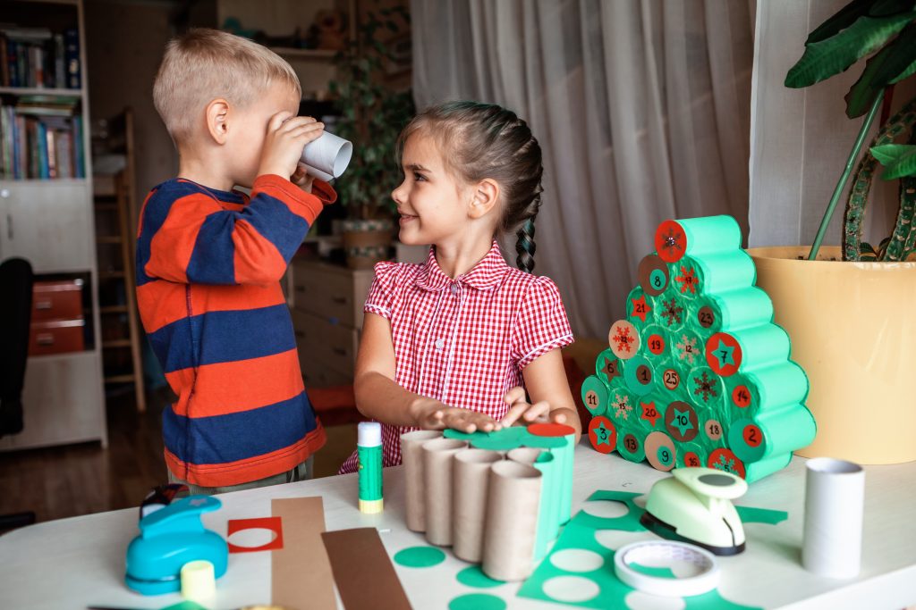 Sharasa kids making handmade advent calendar with toilet paper rolls at